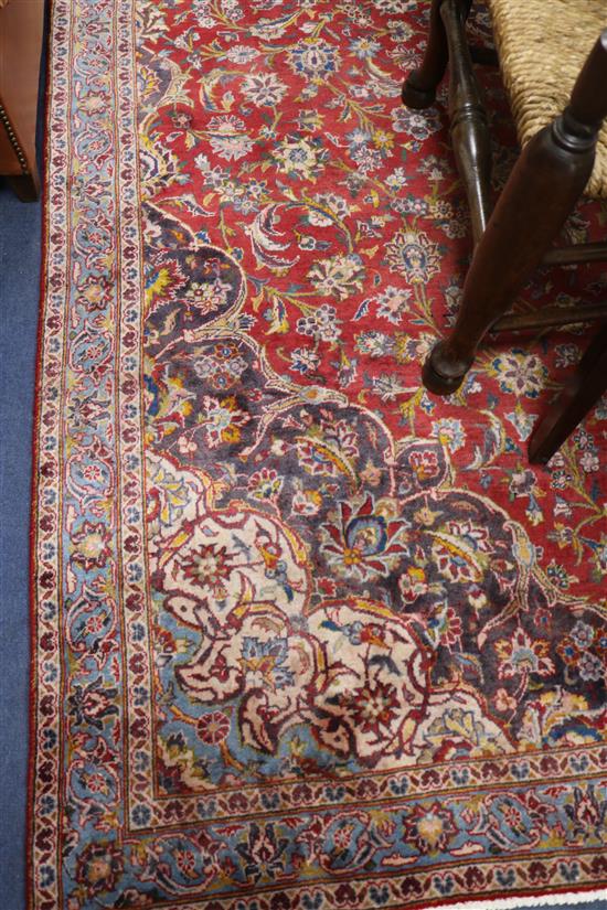 A Kashan red ground carpet, 10ft 10in by 7ft 3in.